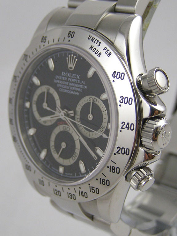 Rolex SS Daytona ref # 116520 F serial # circa 2004 with black dial. Super minty condition with original box & papers. This is the popular current model with Rolex in house movement, preowned in minty condition complete with box and papers.