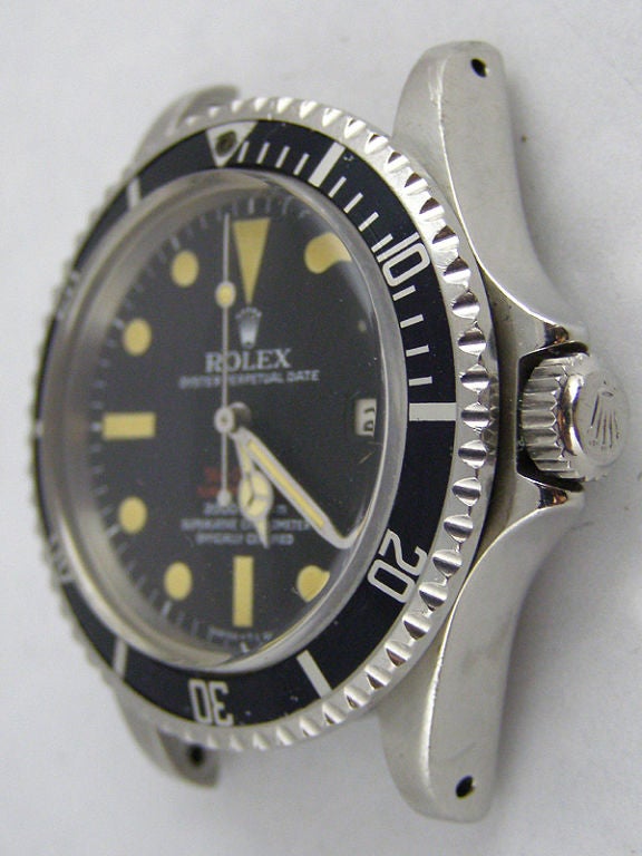 Rolex SS Double Red Seadweller ref # 1665 serial # 3.118 million circa 1972<br />
with magnificent original Mark III matte black dial with original untouched<br />
nicely patina'd luminous indexes and matching mercedes hands.  Calibre 1570<br