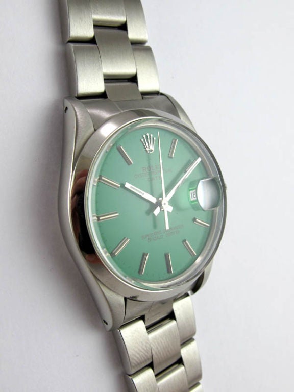 Rolex SS Oyster Perpetual Date ref #1500 34mm diameter smooth bezel case, serial #2.8 million circa 1971. Smooth bezel, custom colored Kelly green dial with applied silver indexes and baton hands. Calibre 1570 self winding chronometer rated movement
