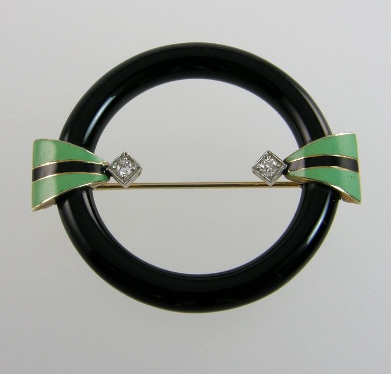 Green and black enamel enhance this beautiful Onyx Art Deco Brooch.  Set with 2 diamonds.