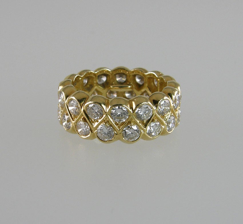 A beautiful, sparkly double row diamond band with approximately 3.75 carats of G-VS1 round brilliant cut diamonds in 18 karat yellow gold from circa 1990s.  

The band is a size 6 with little spacers so it will also fit a 5 1/2.  They could be