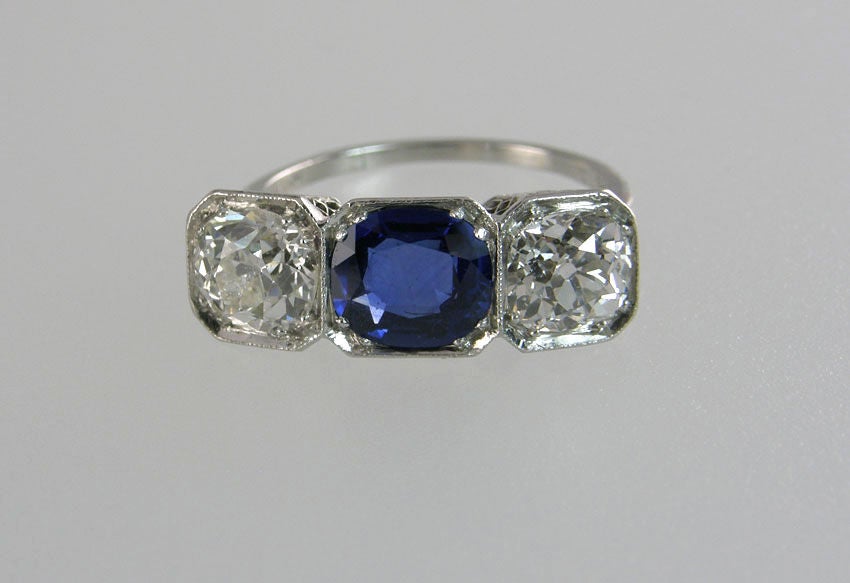 Sapphire and Diamond Art Deco 3 stone ring.  The center sapphire is 1.50 carat natural untreated Cambodian, GIA certificate.  The diamonds are 1.14 and 1.15cts K-VS1 clarity, both with GIA certificated.  The ring is signed "Bohn Allen"