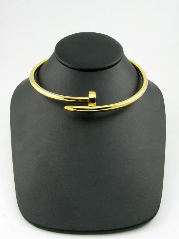 An unusual and chic 18 karat gold curved nail choker style necklace by A. Cipullo.