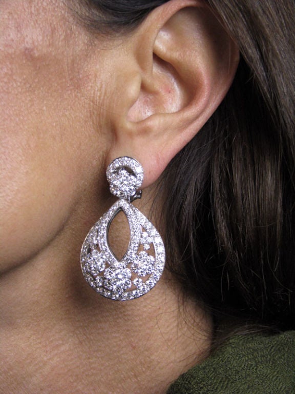 A pair of platinum, white gold and diamond large earrings:<br />
- model 