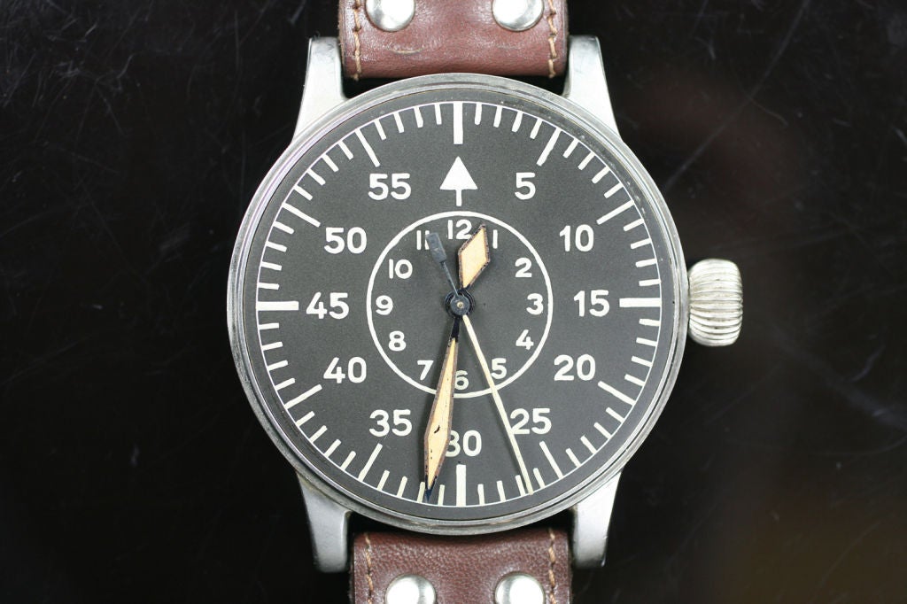 A great example of a WWII Pilot's watch made by A.Lange & Sohne. This has a beautiful original Aviator's dial with a manual wind movement. It is made of a special non-magnetic alloy of nickel silver. The extra big case is fitted with a wide band