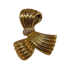 Van Cleef et Arpels gold and diamond twist brooch Van Cleef et Arpels gold and diamond twist brooch