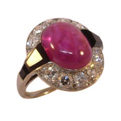 An Art Deco pink sapphire and onyx ring