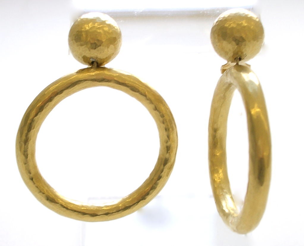 A smart pair of hoop earrings by Paloma Picasso for Tiffany and Company, Italy. The 18k yellow gold hammered finished  1/2