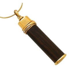 Talisman: An 18k Gold and Wood Pendant by Cartier, c1970