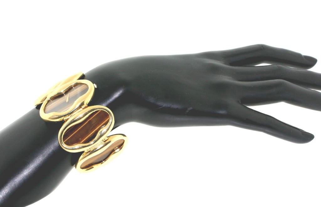 Amazing 1970s Chopard! Large polished 18k gold oval links with tiger eye inset. Incredibly stylish and chic. These beautifully designed signed jewelry watches are getting harder and harder to find and this is a FABULOUS one!