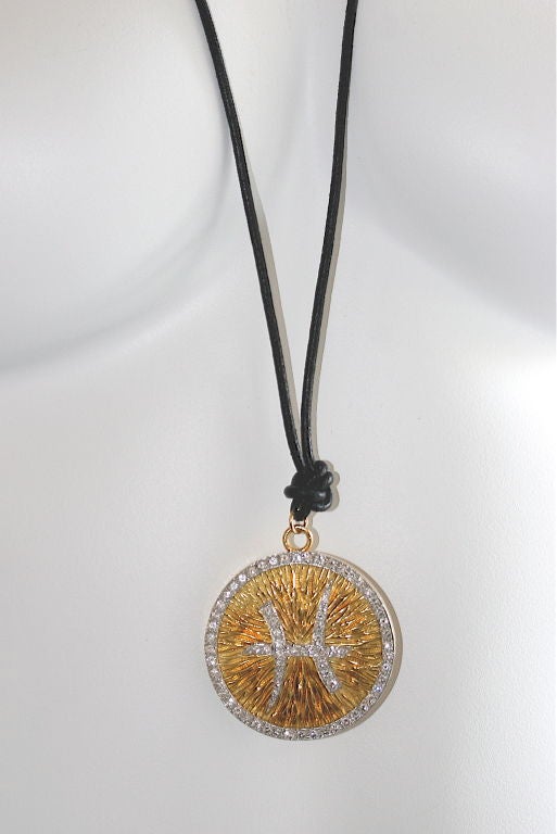 David Webb 18k hammered gold zodiac Pisces medallion in diamonds and surrounded by diamonds with approximate total weight 4 carats set in platinum, diameter 2