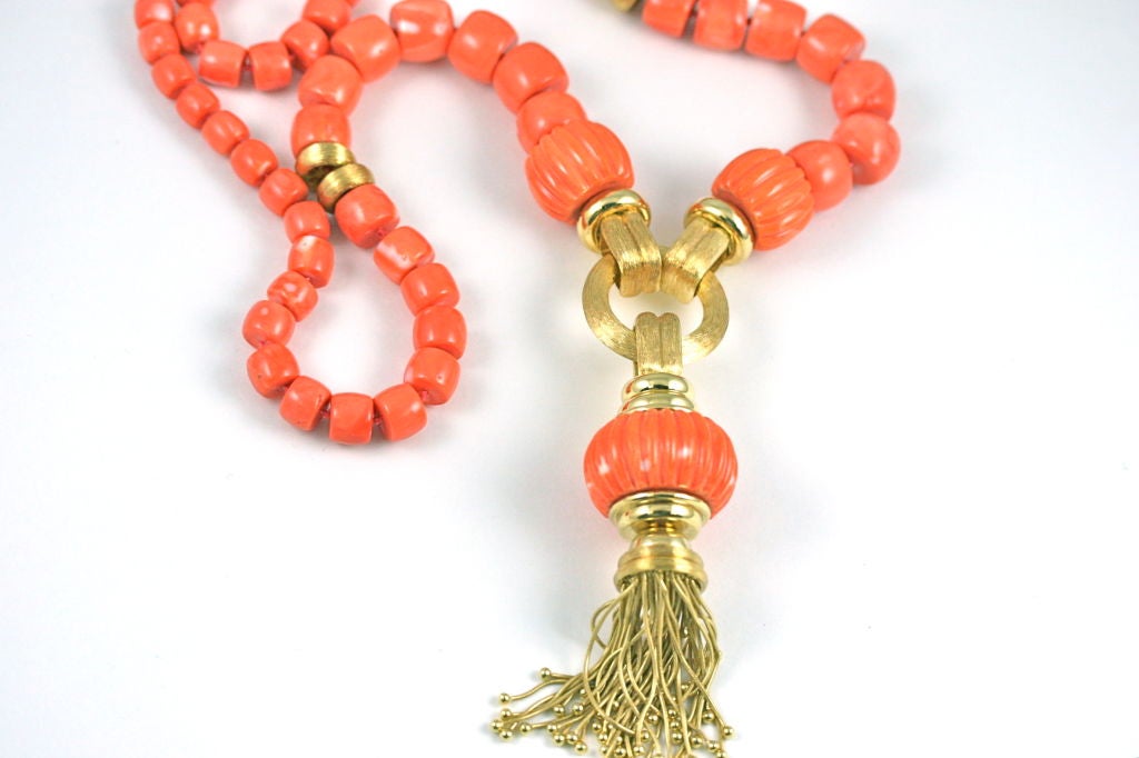 Henry Dunay beautiful coral beaded necklace with interspersed 18k brushed gold beads and a fabulous swinging gold tassel and carved coral drop, 34