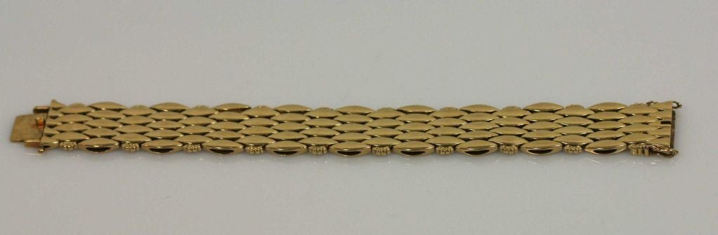 Georg Jensen 18kt gold bracelet No. 350 designed by Harald Nielsen in 1945.  Bracelet bears impressed company marks and measures 7.625