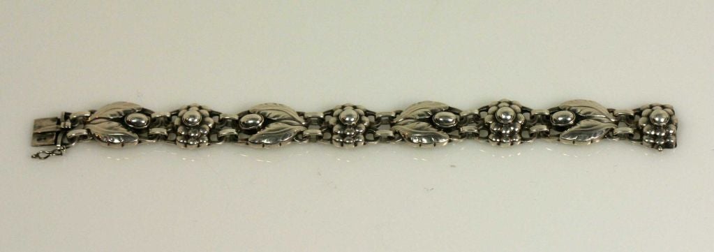 Georg Jensen sterling silver bracelet No. 3.  Originally designed by Georg Jensen in 1905.  This is a bracelet bears the leaf, berry and flower motifs that are distinctive to Georg Jensen's design work. The bracelet measures 7 1/4