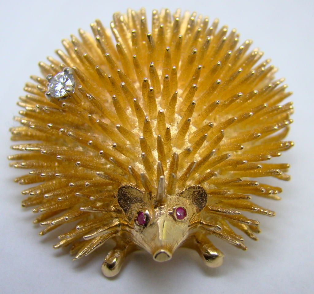A 14 Karat Yellow Gold, Ruby & Diamond Hedgehog Pendant - 0.06 carat Diamond, Ruby eyes, stamped 14k, Estate