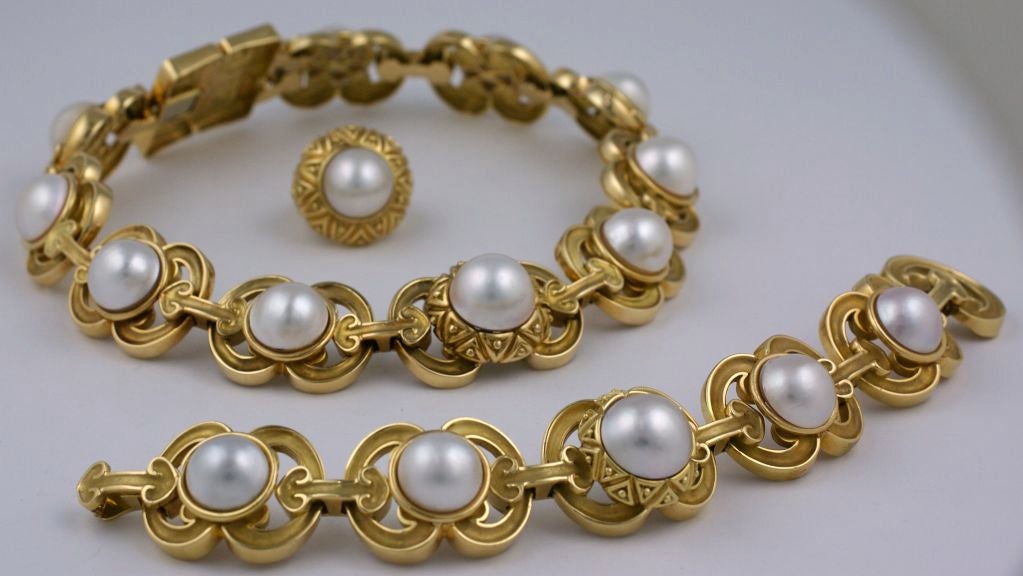 Large scale 18K French necklace, bracelet, ring by Wander. Large mabe pearls set into links which are both shiny and matte finish. Large square motif closure 1.25