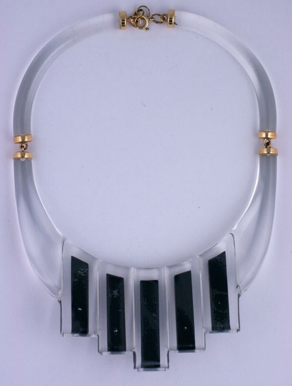 This unusual custom designed collar of clear lucite and black bakelite in a stepped deco style was made from the original owners gemstones and diamonds in the 1970's. Bars of diamonds, diamonds with faceted rubies, diamonds with cabochon emeralds