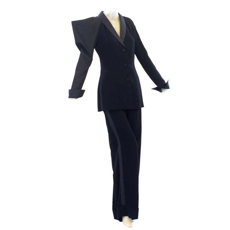 Uniquely beautiful tuxedo from the great architect of fashion, Gianfranco Ferre.  The taffeta sleeve with cutout detail on the shoulder can be worn up for a dramatic look or pushed down for a still dramatic more subtle look.   The pants are cut