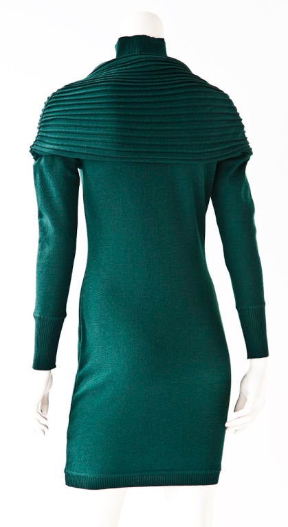 Montana bottle green wool long sleeved sweater dress. Fitted body with an attached  ribbed 