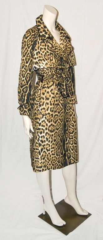 Yves st. Laurent leopard print trench with patent leather detail.<br />
Trench collar, lapels, cuffs and yoke are edged in fine patent trim. Very lightweight easy classic shape.