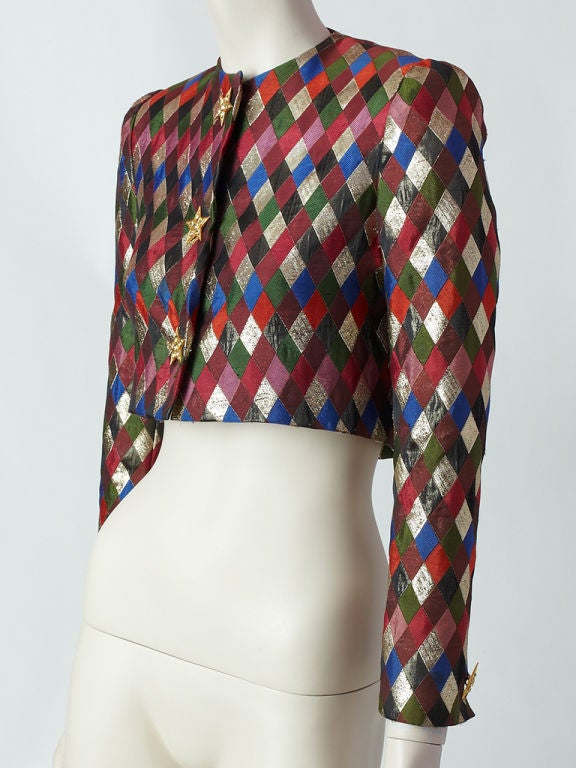 Nina Ricci harlequin pattern brocade cropped evening jacket.<br />
Beautiful fabric with woven gold lame 