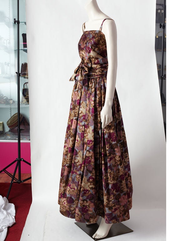 Vera Maxwell  floral print silk 2 pieces ensemble consisting of a thin strap bodice that wraps around the front and and crosses at the back. The long skirt is gathered at the waist with a buckram lined hem giving the skirt a bouffant silhouette.