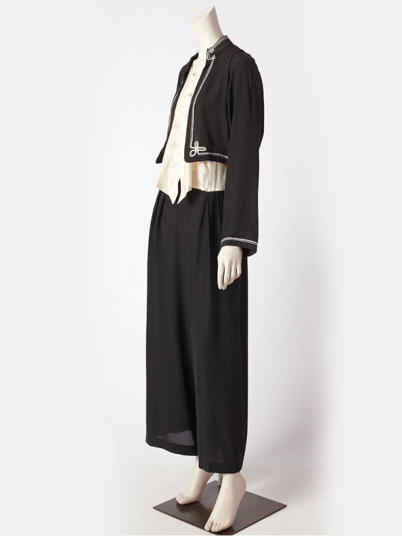 Matsuda, silk, black + ivory jumpsuit with wide trouser. This jumpsuit is entirely one piece. It has a cropped jacket trimmed in white soutache  which sits over an ivory jacquard vest and then<br />
a wide cropped trouser. This is a unique piece.