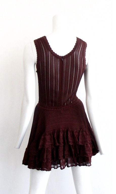 Speechless! This dress is beyond words.<br />
This fantastic frock is done in a prefect berry burgundy, it has a scallop edge around the deep V - neck line and a subtle lace ruffle at the bottom and lets not forget the Bustle in the back, WOW.