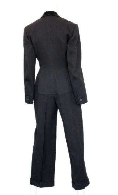 To Die for!! ALAIA!<br />
This is the ultimate tuxedo jumpsuit with a low cut neckline.<br />
It is cut high in the inseam to accentuate the backside - WOW!<br />
The fabric is a traditional gaberdine with velvet trim and a cuffed hem.