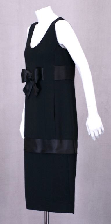 Classic Beene cocktail dress in wool crepe with satin ribbon trim.<br />
Versatile one piece style channels the glamour of the 1950's Haute Couture.<br />
Excellent Condition<br />
Zip back closure.