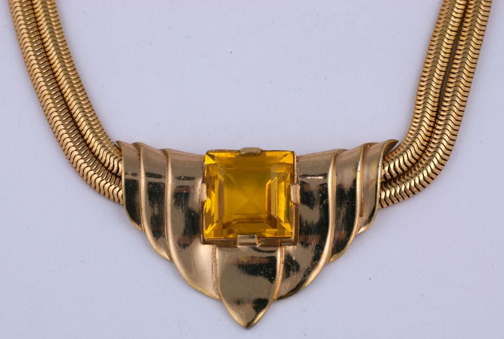 Retro style Trifari necklace with snake chain and center motif with  large faux citrine circa 1940. Soft yellow gold with pink undertone.<br />
Excellent condition<br />
Length: 16"    Depth 1.5"<br />
Signed Trifari