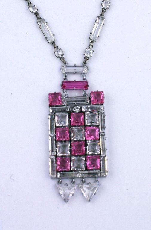 Stunning art deco checkerboard pendant of clear and french rose facetted crystals. There are 2 triangular articulated drops at the bottom of the pendant which move with wearer. Crystal baguette and round crystal chain is mixed with silvered bar