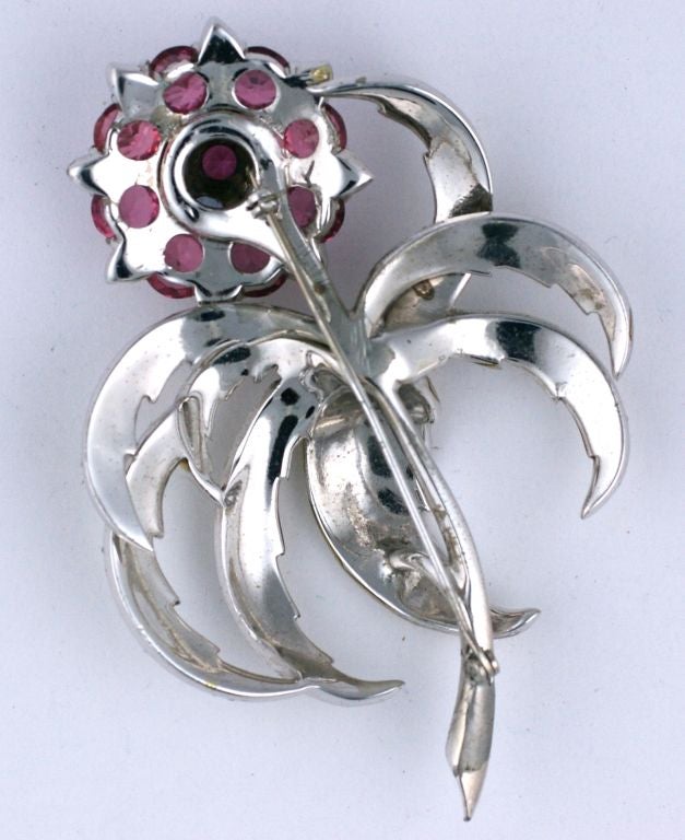Rare Unsigned Marcel Boucher Spray brooch dating from the late 1930's-40s. Signature pearlized enamel decorates the fronds with rose and pale aqua crystals forming the bud. High rhodium metal.
3.75 x 2.75
