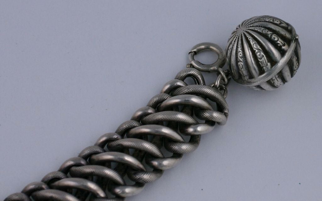 Attractive sterling link bracelet with fancy etched ball fob from the late 19th Century, UK. Beautiful quality and workmanship.<br />
Excellent condition<br />
8