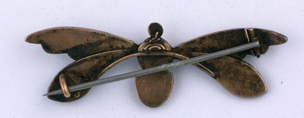 Lovely wasp brooch in pave turquoises and seed pearls. The body and head are tigers eye and there is a cats eye crysoberyl cabochon in the center. Insect brooches were all the rage in the late 19th C. Mounted in silver topped low carat gold.