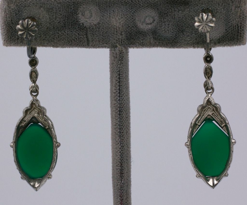 Art Deco sterling and marcasite articulated earrings by Wachenheimer, Germany. This company manufactured elegant art deco jewelry for the high end market in the 1930's. Green onyx cab at the ear and on the drop. Signed.<br />
Excellent condition