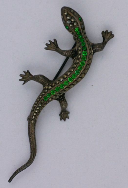 Charming paste set and marcasite salamander brooch set in sterling circa 1930s. Emerald pastes set to replicate demantoid garnets.<br />
2.75