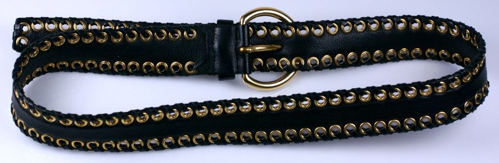 Miu Miu by Prada belt.Grommeted and whipstiched black leather. Fits 30