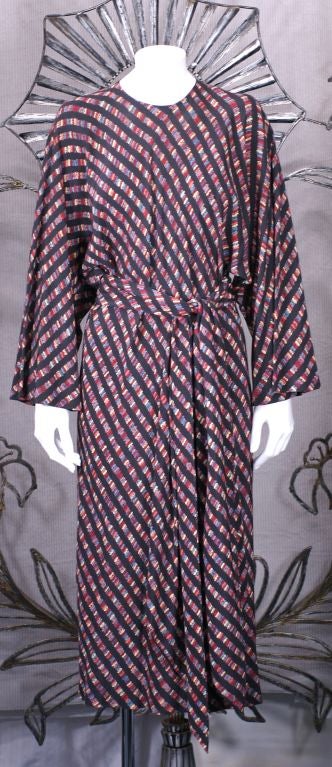 Halston's Easy Bias Cut Silk Crepe dress with large kimono sleeves and bias raglan back closure. Printed silk crepe is folded in half on bias and 