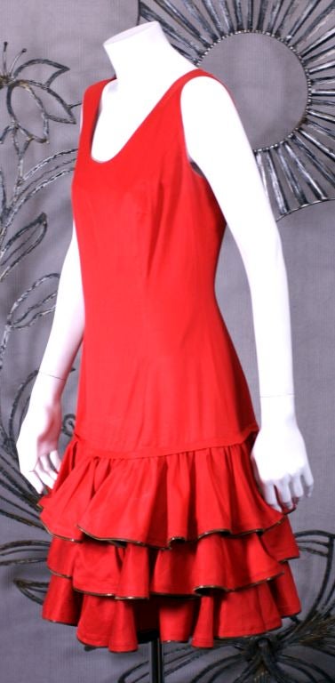 Moschino red cotton summer dress. Tank style with a flourish of metal zipper trimmed ruffles at the hem. Back zip.
Length: 36