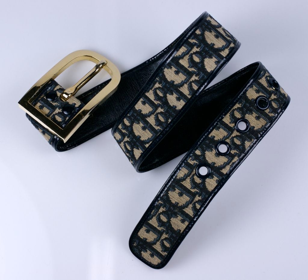 Attractive Dior tapestry logo belt with large gilt buckle from the 1970s. Lined and edged in navy calf leather.<br />
Made in France<br />
Fits 25