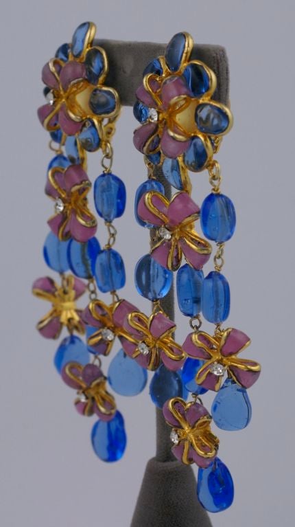 Beautiful Chanel poured glass earrings from the 1980s. Pink poured glass bows are interdispersed througout sapphire pate de verre beads. Handmade by Maison Gripoix for Chanel,<br />
4.5