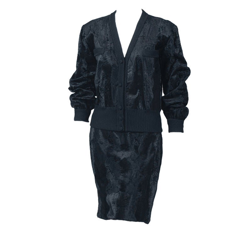 This black broadtail suit retailed by Amen Wardy, LA has such a fabulously chic and wearable style.  Worn together or separately these pieces will be a great addition to your wardrobe.  <br />
The sporty bomber jacket is collarless with a low