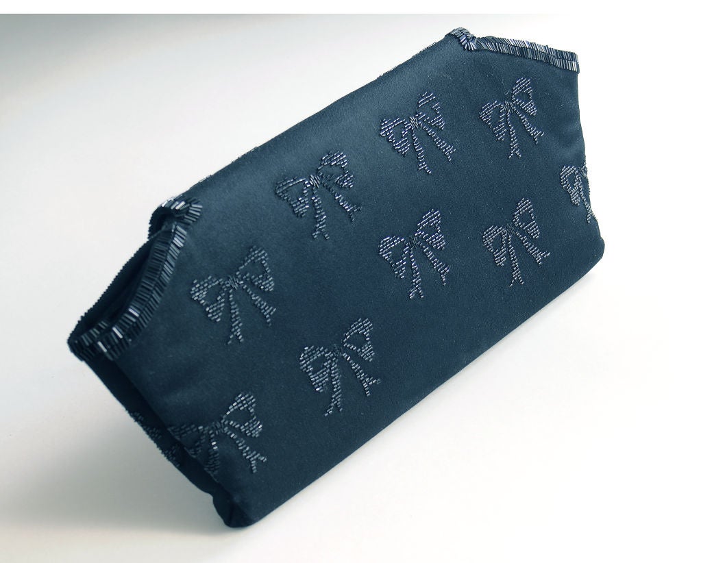 One of the most glamourous handbags that I have ever owned, this striking oversized clutch would be a great addition to any collection.  The generous size allows you to carry all of your everyday necessities, and it easily goes from day to evening.