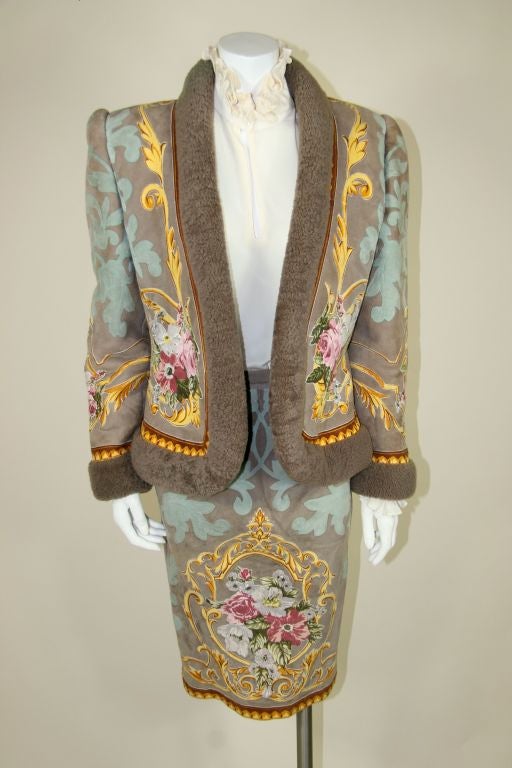 Jacket is taupe shearling with fleece inside jacket and bordering the jacket. Elaborate suede turquoise detail sewn on and printed floral suede applique on front, back and sleeves and skirt.  <br />
<br />
Measurements:-<br />
Jacket:-<br