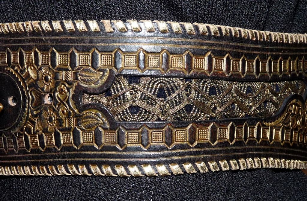 Ceasar of Gstaad handmade belt. The belt is leather with velvet inlay and gold detail. The buckle has wood inlay. Gold leather is threaded around the edges. In the buckle there is 'Ceaser of Gstaad' inscribed. <br />
<br />
Measurements:-<br
