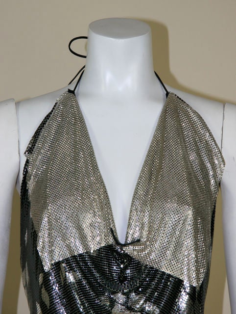 Whiting and Davis gunmetal top with silver leaf design, with silver over collar. Open back with ties at neck and back. Draping begins at decolletage. <br />
<br />
Measurements:- <br />
20