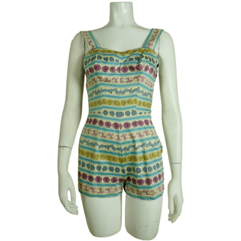 Rose Marie Reid 1950's swimsuit/playsuit using a Pucci cotton horizontal print. Smocked panels in back, adjustable straps<br />
<br />
Bust-32