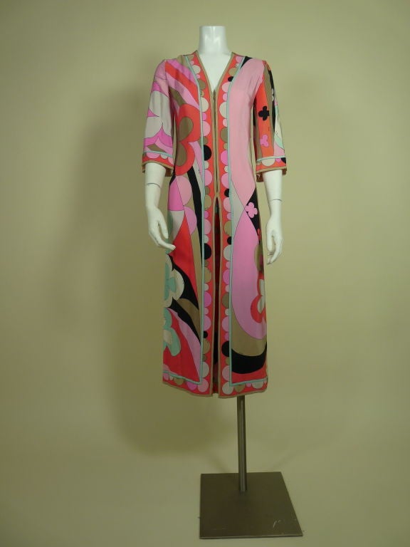 1970’s signature psychedelic Pucci print silk jumpsuit with zip-front.  Pant legs are pleated from the center seam to add fullness. <br />
<br />
Measurements:<br />
<br />
Bust: 34