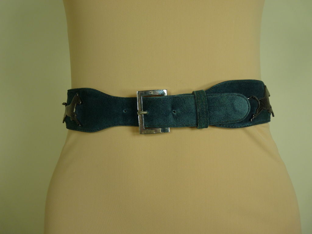 Incredible dark teal wide suede belt from Gucci with niello enameled silver zebras and criss-cross, triangular cutout detail. Chrome buckle with Gucci stamp on tongue.

